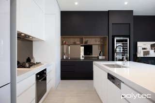 polytec KITCHEN - Doors, drawers and panels in Ultra White Venette, Overhead cupboard doors in Black Venette, Shelving in Notaio Walnut Ravine.