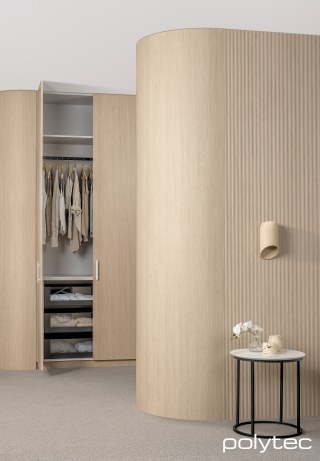 polytec WARDROBE - Wall panels in Calcutta 10,  with Coastal Oak Woodmatt, Wardrobe doors in Chifley,  with Coastal Oak Woodmatt, Curved wall panels in Coastal Oak Woodmatt, Wardrobe internals in Natural Cotton Matt, Tabletop in Calacutta D'oro Smooth.