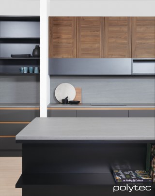 polytec KITCHEN - Avellino doors in Notaio Walnut Woodmatt, Benchtop in Tunisia Stone Matera, Doors in Cinder Venette, Drawer Rails in Bronze Gold Leaf Matt.