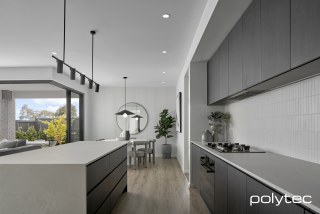 polytec KITCHEN - Doors and panels in Black Ply Woodmatt, Wall linings in Channel 25.