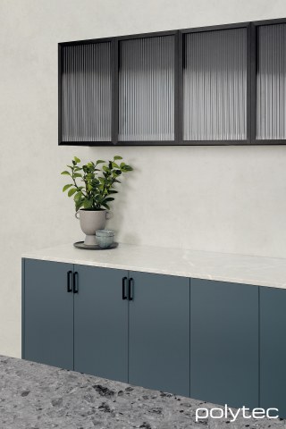 polytec KITCHEN - Cabinets in Habitat Venette, 21mm Tightform Benchtop in Portofino Stone Smooth, Island Benchtop in Vesuvius Ceppo Smooth, Overhead cabinets in 23mm Brushed Black Frame,  with Fluted Glass Insert.