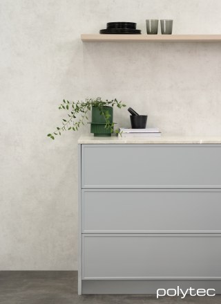 polytec KITCHEN - Benchtop in Portofino Stone Smooth, Splashback in White Cement Smooth, Thermolaminated doors & panels in Sussex,  and Elemental Grey Smooth, Shelf in Ligurian Walnut Woodmatt.