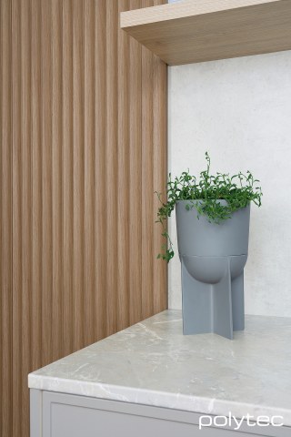 polytec KITCHEN - 21mm Tightform Benchtop in Portofino Stone Smooth, Thermolaminated doors & panels in Sussex,  and Elemental Grey Smooth, Splashback in White Cement Smooth, Shelf in Ligurian Walnut Woodmatt, Steccawood in 17mm x 34mm Cove profile	 in Prime Oak Woodmatt.