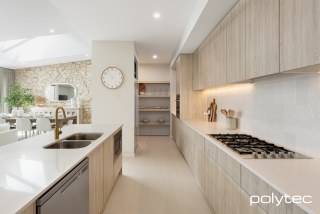 polytec KITCHEN - Doors, panels and shelving in Ligurian Walnut Woodmatt.
