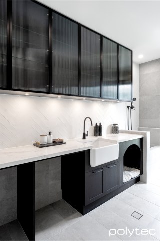 polytec LAUNDRY - Doors & panels in Hampton,  with Tempest Woodgrain, Overhead doors in 23mm Brushed Black Frame,  with Fluted Glass Insert.