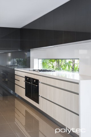 Polytec - Doors and panels in Cavia Lini Gloss,  and Bleached Walnut Ravine.