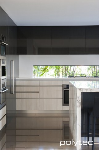 Polytec - Doors and panels in Cavia Lini Gloss,  and Bleached Walnut Ravine.