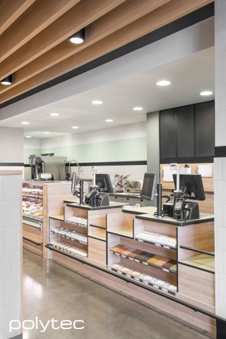 polytec COMMERCIAL & ARCHITECTURAL - Melamine and Laminate retail joinery in Natural Oak Ravine.