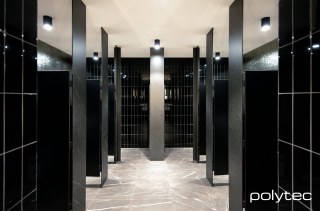 polytec COMPACT LAMINATE - Toilet Partitions in Athena Stone Smooth,  and Black Matt.