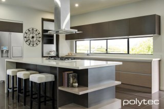 Polytec - Melamine overhead doors and panels in Truffle Lini Matt, Melamine drawers in Rocco Lini Matt.