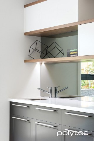 Polytec - THERMOLAMINATED Casino doors in Tempest Woodgrain, THERMOLAMINATED Guilford drawers in Tempest Woodgrain, Shelving in in Sepia Oak Ravine.