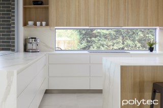 polytec KITCHEN - Xenolith benchtop in Calacutta D'oro Smooth,  with Natural Oak Ravine, Bevel Edge doors in Blossom White Matt.