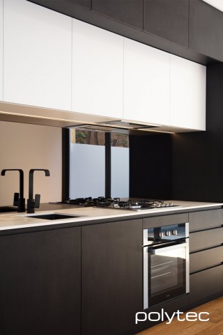 polytec KITCHEN - Cabinetry in Black Woodmatt,  and Ultra White Venette.