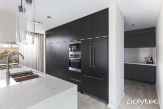polytec KITCHEN - Doors and panels in Cinder Matt, Rails in Light Brass Leaf Matt.